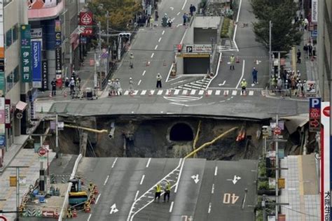 Huge Sinkhole Swallows Street In Japan