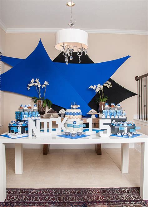 In teenage boys don't like to celebrate their birthday with a pirate or cartoon character theme. 15th birthday blue and white www.bloomingtable.com | Boy ...