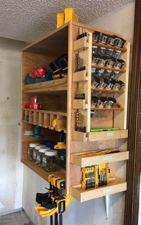 Power tool organization, garage storage, workshop design, pegboards, tool storage, workbenches, lumber racks. Spice rack for screws on charger station | Diy garage ...