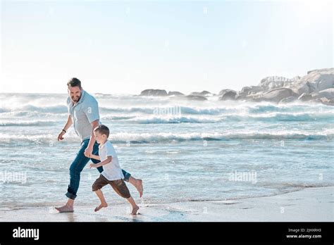 Single Dad Playing With His Son On A Beach Day Caucasian Single Father