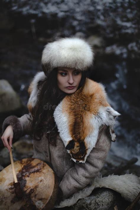 Portrait Of A Woman Wearing Fur Hat And Fox Fur Pelt On Her Shoulders