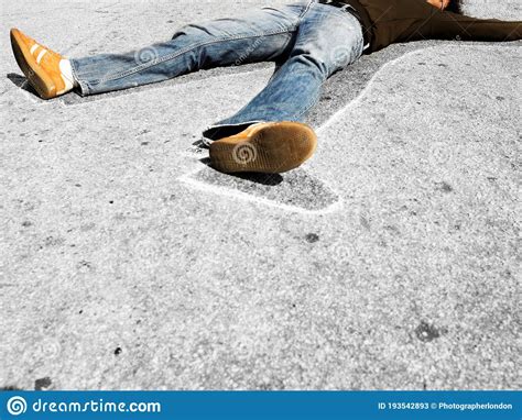 Man Lying In Dead Man Chalk Outline On Concrete Stock Image Image Of