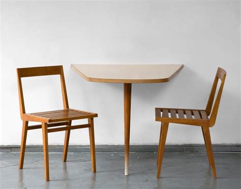 The table doesn't have leaves to extend it, so my dad made a plywood top the extension top gets stored against a wall in my garage. Wall-Mounted Dining Table by Joaquim Tenreiro at 1stdibs