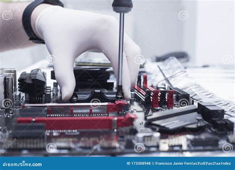Hands Of A Technician Assembling Computer Hardware Parts New Cpu Is