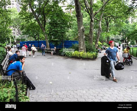 People Sitting On Benches High Resolution Stock Photography And Images