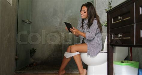 Woman Sitting On Toilet Use Tablet Computer Babe Girl Touch Screen