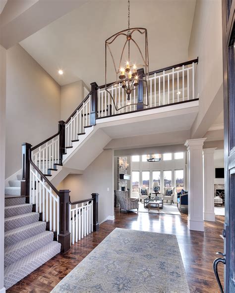 Entry Curved Staircase Open Floor Plan Overlook From The Upper Level