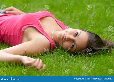 Beautiful Smiling Girl Lying On The Grass Stock Photo Image