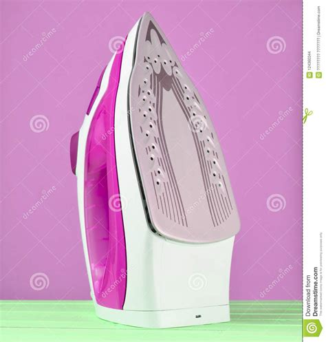 Iron For Ironing On A Colored Pastel Background Minimalist Trend