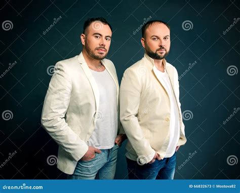 Portrait Of Two Men In White Suits Stock Image Image Of People Background