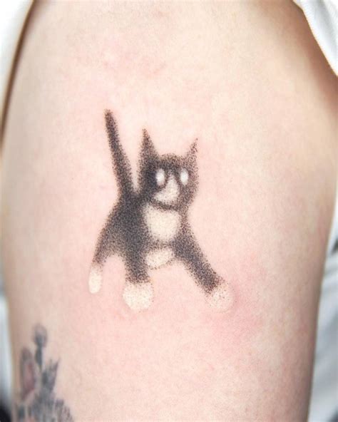 Hand Poked Tuxedo Cat Tattoo Located On The Upper Arm