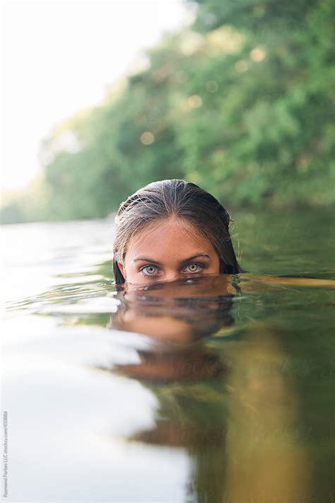 Beautiful Eyes Of Girl Submerged In Lake By Raymond Forbes Llc