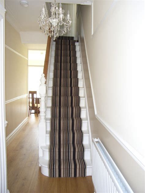 Now here is a unique decorating idea for stairway walls. engineered oak hall floor with striped stair carpet runner ...