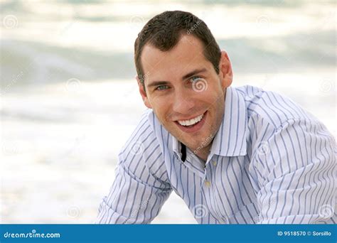 Portrait Of Smiling Handsome Man Looking At Viewer Stock Photo Image
