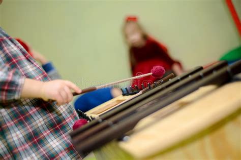 Children Play On Xylophone Music Lesson For Children Stock Photo