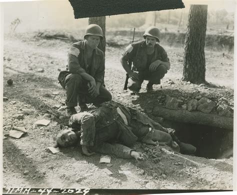 us soldiers look at a deceased german soldier in france on 17 august 1944 the digital