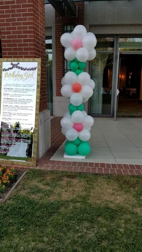 60th birthday balloon the perfect way to finish your floral display on this very special day. This beautiful flower column was a new design for a 60th ...