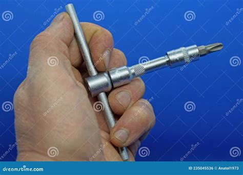 Hand Holds A Gray Iron Screwdriver Stock Photo Image Of Blue Holds