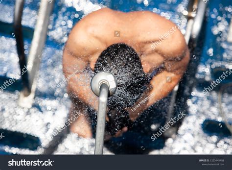 Top View Barechested Man Showering Under Stock Photo
