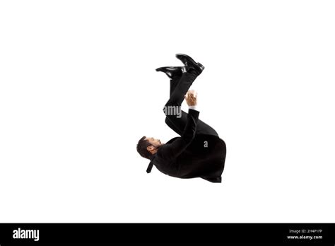 Man In A Black Suit Falling On The Ground Isolated On White Background