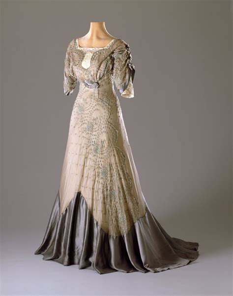 A Typical Late Edwardian Party Dress With A High Waist And Fitted Upper