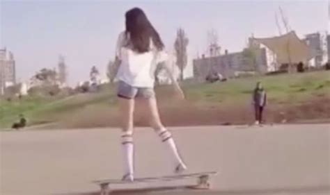 Asian Girl Skates On Longboard In Seoul Dancing And Jumping On Her
