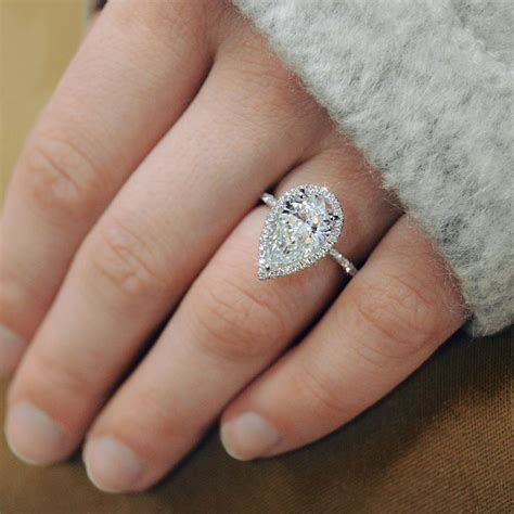Pear shaped diamonds also have more visible surface area how much is a 1 carat pear shaped diamond? One spectacular Pear shape diamond halo engagement ring by ...