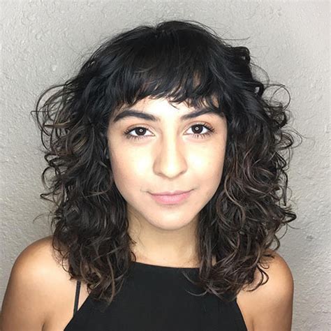 She's chosen structured spiral curls that form gorgeous ringlets, and a sweeping side fringe that accentuates her eyes. 20 Most Incredible Curly Hairstyles With Bangs