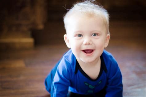 Cutest Baby Boy In Blue Dress On Floor