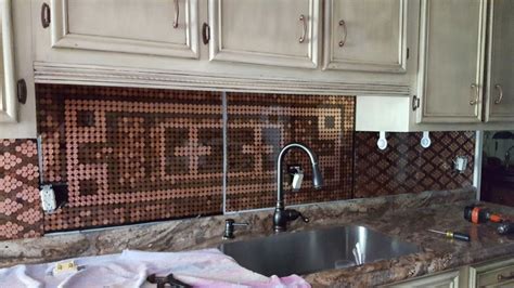Installing a penny tile backsplash and a floating shelf below the mirror made a huge difference to this master bathroom makeover! DIY Penny Backsplash! | Penny backsplash, Herringbone ...