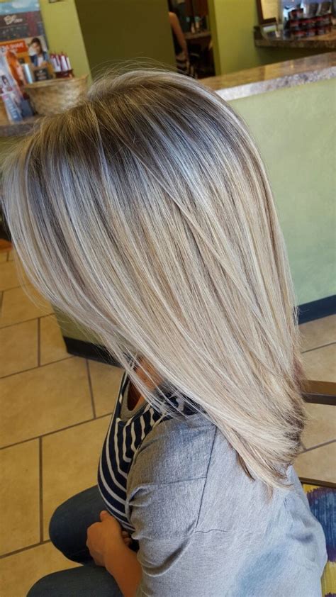 The style is characterized by hair that is dark at the base and gradually becomes lighter. Icy blonde highlights with light brown low lights | Hair ...