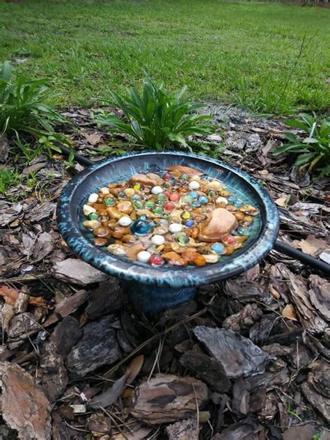 These bird baths attach directly to your deck railing. This butterfly watering spot was created in a small ...