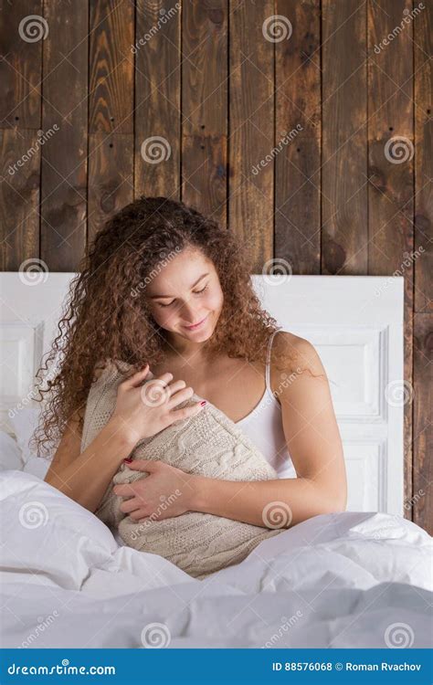 Beautiful Girl Sitting In Bed And Hugging Pillow Stock Photo Image Of