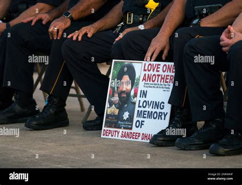 Harris County Sheriffs Office Deputies Hold A Sign During A Vigil For