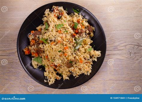 Pilaf With Beef Carrots Onions Garlic And Spices Plov Stock Image
