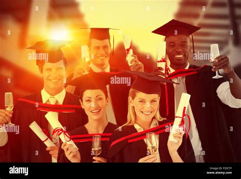 Composite Image Of Group Of People Graduating From College Stock Photo