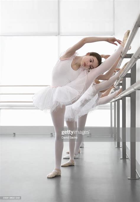 Girl Stretching At Bar In Ballet Class High Res Stock Photo Getty Images