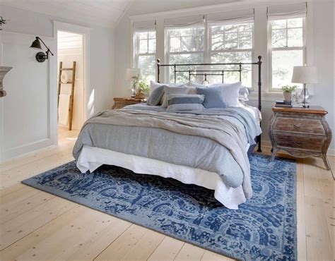 A king sized bed pairs well with an 8'x10′ rug when almost the entirety of the rug is placed underneath the bed and there's only an 18 gap between the top of the rug and the nightstands. What Size Rug do you put under a King Size Bed? | Decor Snob