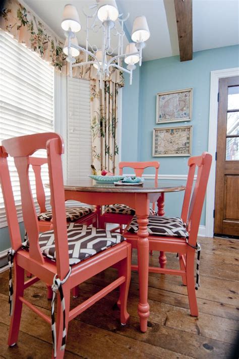 Interior of modern bright turquoise kitchen with painting on white brick wall. Decorating with Coral: Ideas & Inspiration