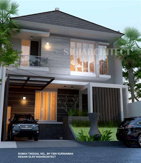 Rumah tropis ini menggunakan kusen kayu supaya terlihat alami. Rumah 2 lantai type 250 M2 rumah modern minimalis