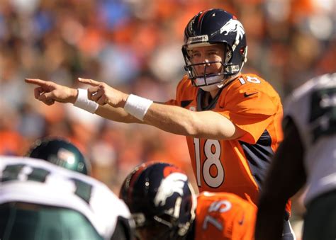 Quarterback Peyton Manning 18 Calls An Audible At The Line Of