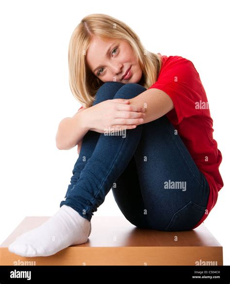 Cute Teenager Girl Feeling Lonely Sitting Alone With Knees Pulled Up