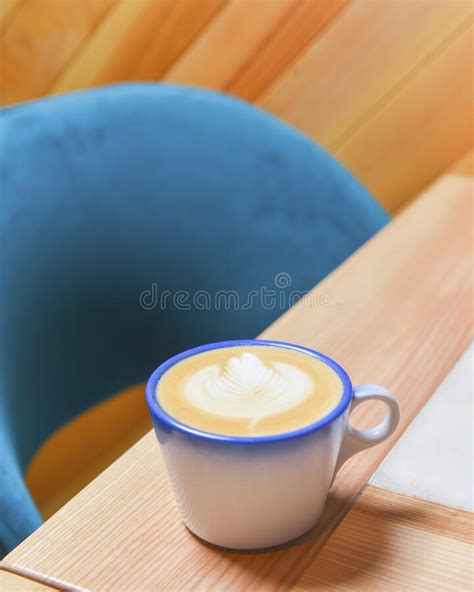 Coffee Cup With Coffee Foam On Wooden Table Latte Coffee In Restaurant