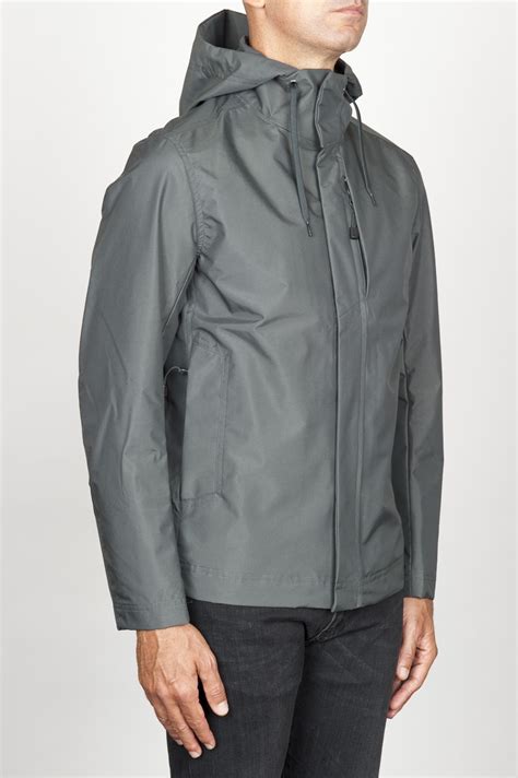 An outer covering or casing, especially: Technical waterproof hooded windbreaker jacket grey