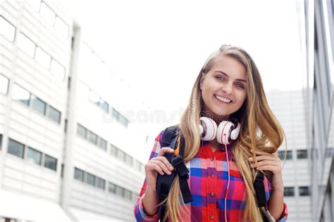 Smiling Female College Student With Bag And Cup Of Coffee Stock Image