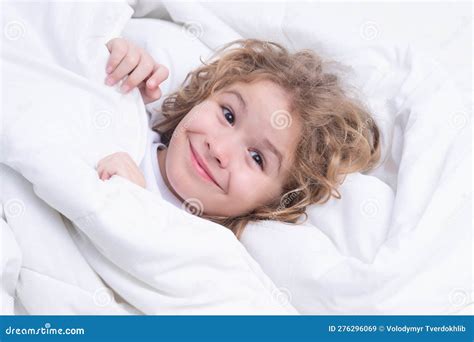 Child Enjoys Sunny Morning Good Time At Home Kid Wakes Up From Sleep