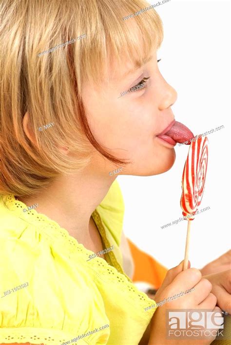 Child Eating Sweets Model 6 Year Old Girl Stock Photo Picture And