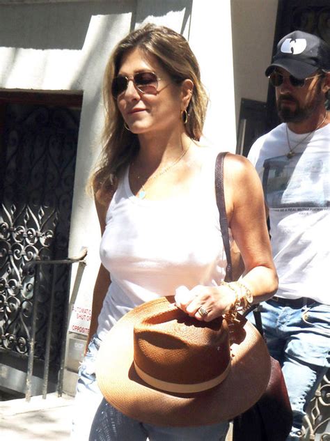 jennifer aniston flashes nipples as she goes braless in tight white vest celebrity news