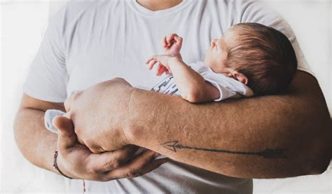 Photo Of Person Carrying Newborn Baby · Free Stock Photo
