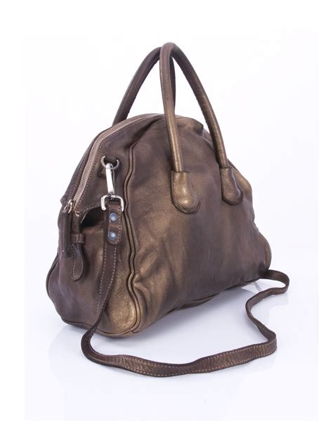 Hobo is an approximately 3 year old shih tzu cross border terrier. Leather handbag | Borse